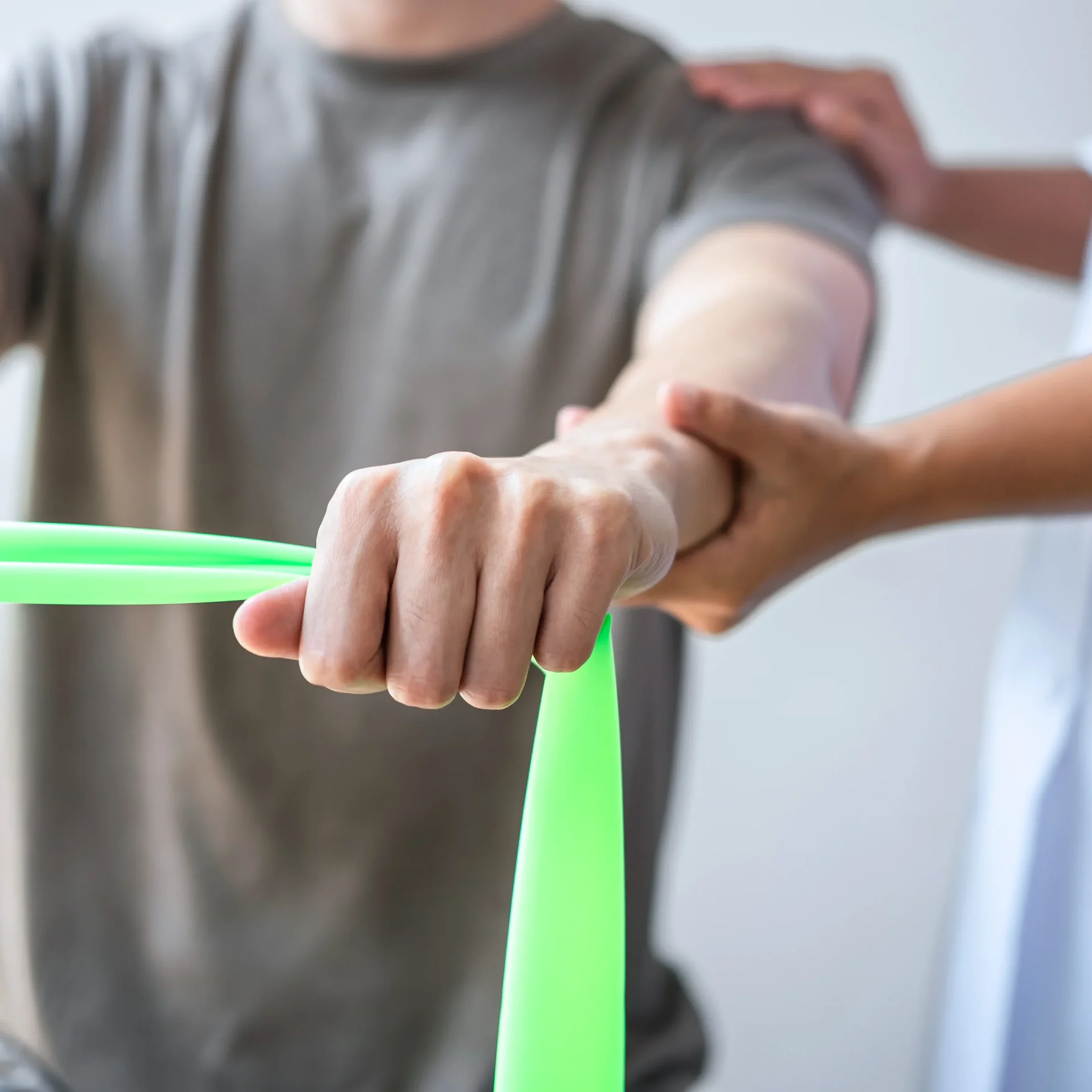 Physical therapy with green resistance band.